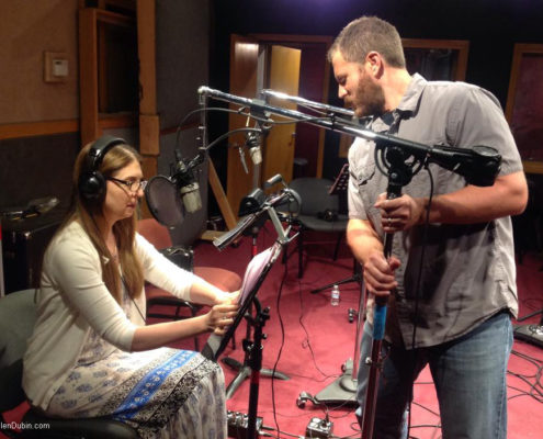 Sound designer Christopher Diehl adjusting the microphone