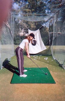 Ellen practicing golf, to “play” a realistic (and sadistic) game of golf on Stanley Tweedle’s head. Ouch!